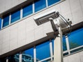 Double security camera in a building