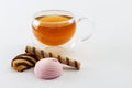 Double sided wall glass cup full of green tea with sweets and biscuits