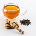 Double sided wall glass cup full of green tea with sweets and biscuits