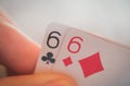 Double six, Playing cards in hand on the table, poker nands