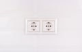 Double socket on white tile background. European electrical outlet Royalty Free Stock Photo