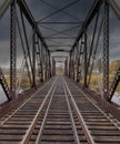Double span riveted railway truss bridge built in 1893 crossing the Mississippi river in autumn in Galetta, Ontario, Canada Royalty Free Stock Photo