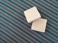 Double Square Cream Wafers on Striped Carpet