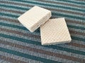 Double Square Cream Wafers on Striped Carpet
