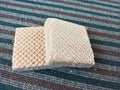 Double Square Cream Wafers on Striped Carpet