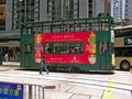 Double-storey-tram runs through a street in Hong Kong