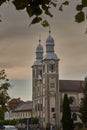 Odorheiu Secuiesc, SzÃÂ©kelyudvarhely /Romania- June 2019: The double towered Franciscan church