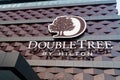 Double Tree Hilton Hotel. Logo on the facade of the hotel building. Minsk, Belarus, october 25, 2023