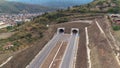 Double tunnel entrance drone shot Town behind Royalty Free Stock Photo