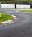 Double turn chicane track motor sport circuit with white banner copy space in background Royalty Free Stock Photo