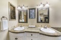 Double vanity sink in a bathroom with stone tiles counter