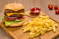 Double veal cheeseburger a wooden board. ketchup Royalty Free Stock Photo