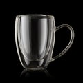 Double walled empty glass cup for espresso coffee on a black background Royalty Free Stock Photo