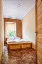 Double Wooden bed in the room of the hostel Royalty Free Stock Photo