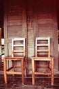 Double wooden chairs on wood house thai retro style