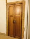 Double wooden door with antique latch.