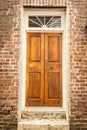 Double wooden doors on the front of a brick home Royalty Free Stock Photo