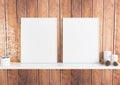 Double 8x10 Vertical White Frame mockup with christmas decorations on white shelf and rustic wooden wall Royalty Free Stock Photo