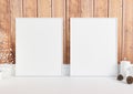 Double 8x10 Vertical White Frame mockup on white floor and rustic wooden wall Royalty Free Stock Photo