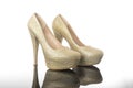 Double yellow gold shiny stone pointed high heels women`s platform shoes Royalty Free Stock Photo