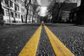 Double yellow lines in city street Royalty Free Stock Photo
