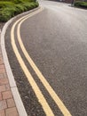 Double yellow lines on curved road Royalty Free Stock Photo