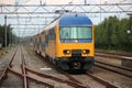 Doubledeck commuter train at station `t harde in the Netherlands