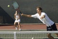 Doubles Player Hitting Tennis ball With Forehand Royalty Free Stock Photo