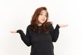 Doubt Confused Gesture Of Beautiful Asian Woman Wearing Black Shirt Isolated On White Background Royalty Free Stock Photo