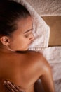 When in doubt massage it out...a young woman enjoying a relaxing massage at the day spa. Royalty Free Stock Photo