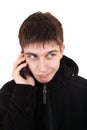 Doubtful Teenager with Cellphone Royalty Free Stock Photo