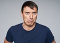 Doubtful young man face Royalty Free Stock Photo