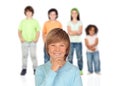 Doubtfully teenager boy with other children Royalty Free Stock Photo