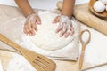 dough in flour kneading childrens hands, one kid, child helps parents in kitchen