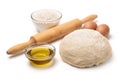 Dough with flour, olive oil, eggs and rolling pin