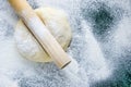 Dough on a floured marble green table, top view