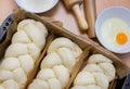 Dough for fresh bread, buns ready for the oven. Fresh homemade cakes for dinner. Royalty Free Stock Photo