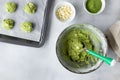 dough with matcha green tea and baked sheet with raw cookies Royalty Free Stock Photo