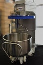 Dough mixing machine with movable bowl