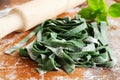 Dough for pasta spinach. Royalty Free Stock Photo