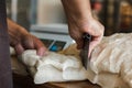 Dough preparation and kneading at baking sheet table in the oven multigrain white flour sesame seeds grain bread person baker cutt Royalty Free Stock Photo