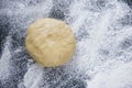 Dough on a floured marble green table, top view