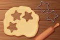 Dough with rolling pin cookie cutter star shape top view cartoon style on wooden table, desk Preparation, cooking.