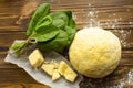 Dough, spinach,parmesan, ricotta on wooden background are ready