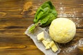 Dough, spinach,parmesan, ricotta on wooden background are ready