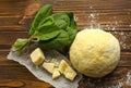 Dough, spinach,parmesan, ricotta on wooden background are ready