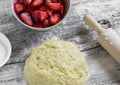 Dough, strawberry, sugar - ingredients for making strawberry pie Royalty Free Stock Photo