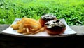 Doughnut and fried potato Royalty Free Stock Photo