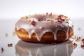 A doughnut with icing and crumbs on a white surface. AI generative image