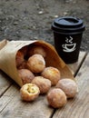 Doughnut. Oat donuts with cinnamon, powdered sugar and coffee. Street food. Round fritter. Space for text